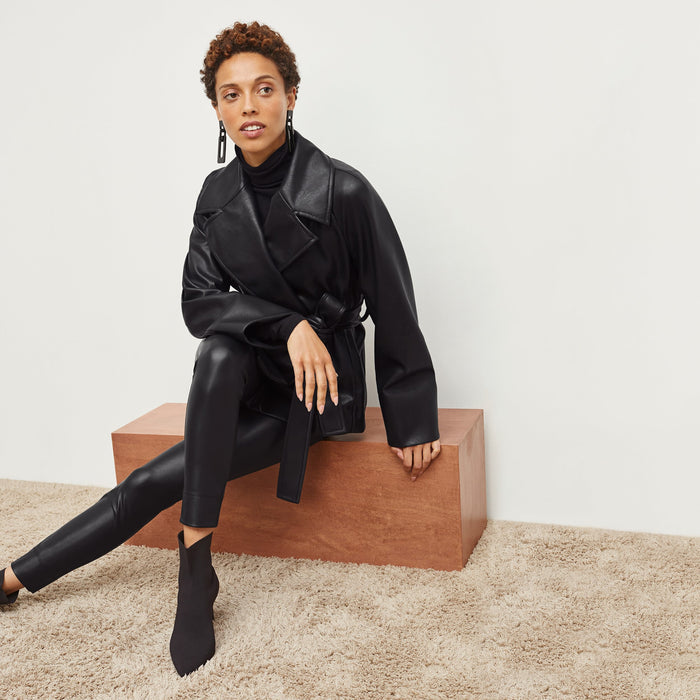 Front image of a woman standing wearing the Alphonso Jacket—Vegan Leather in Black