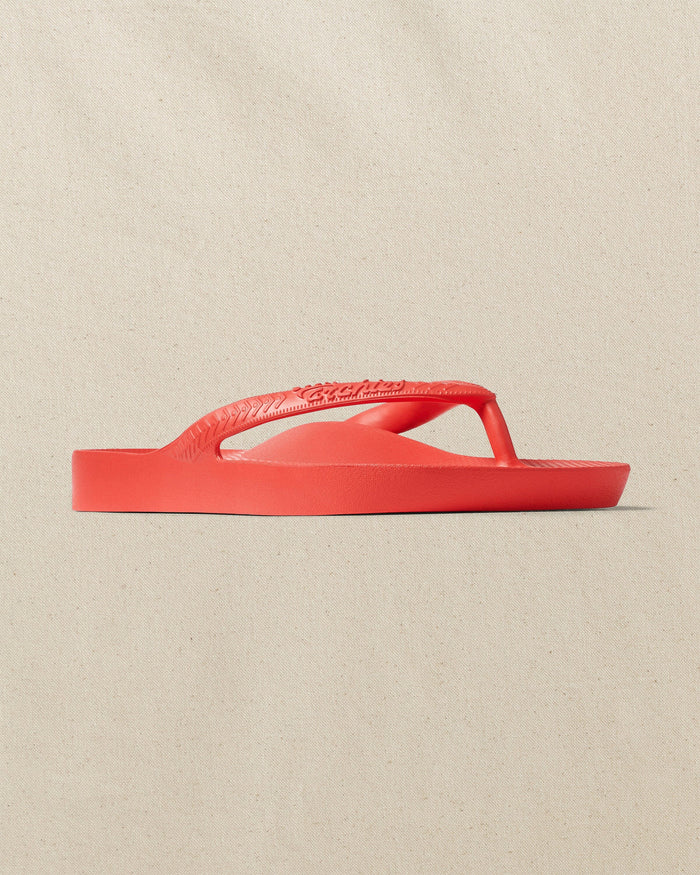 The right angle view of the Southern Tide Archie's Coral Arch Support Flip Flop by Southern Tide - Coral