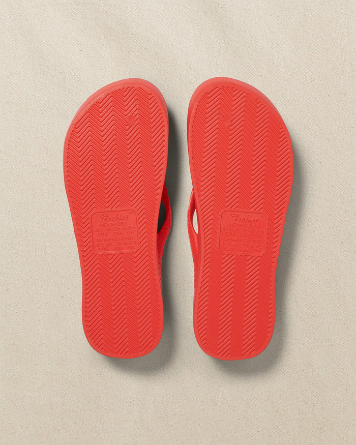 The bottom view of the Southern Tide Archie's Coral Arch Support Flip Flop by Southern Tide - Coral