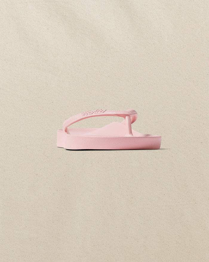 The front side view of the Southern Tide Archie's Soft Pink Arch Support Flip Flop by Southern Tide - Soft Pink