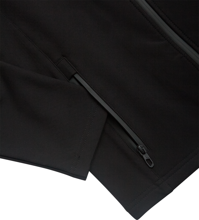 Close-up of a black jacket with a zipper on a white background