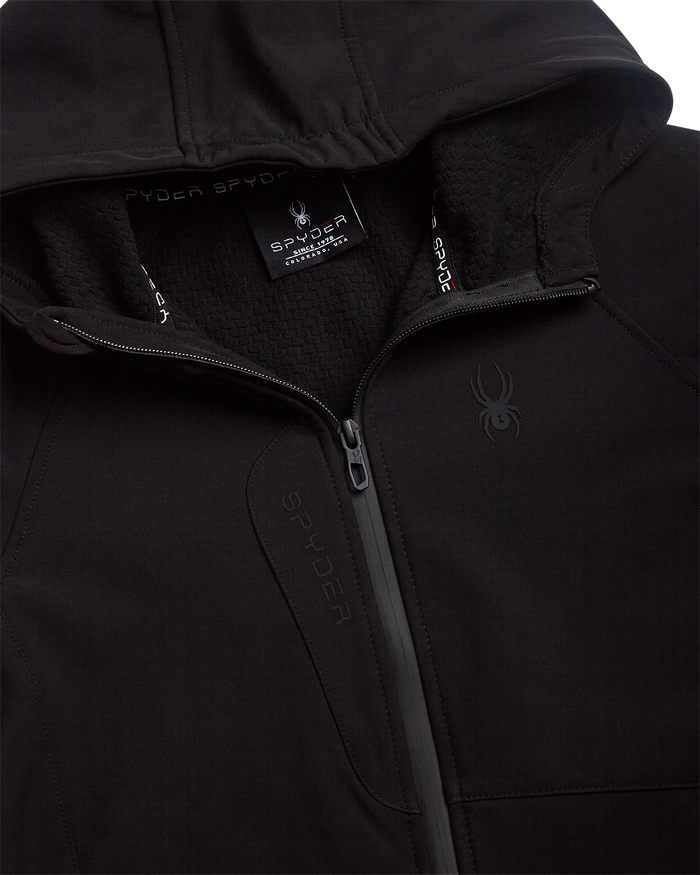 Close-up of a black jacket with Spyder branding on the hood and chest.