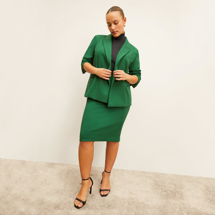front image of a woman wearing the chantal skirt in shamrock