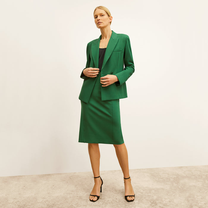 front image of a woman wearing the chantal skirt in shamrock