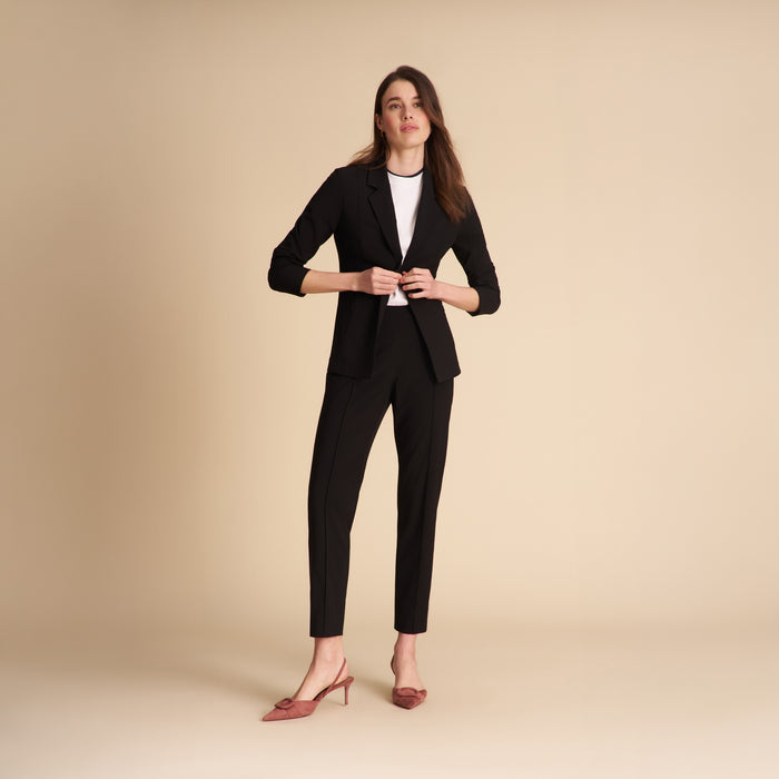 Front image of a woman standing wearing the Colby Jogger in Black