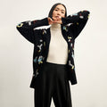 front image of a woman wearing the cookie cardigan in confetti | Lead