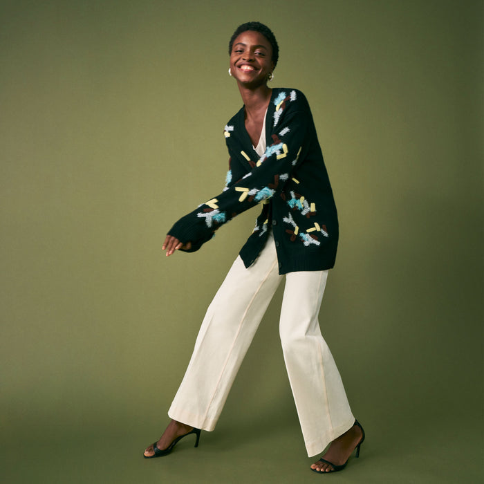 mood image of a woman wearing the cookie cardigan in confetti