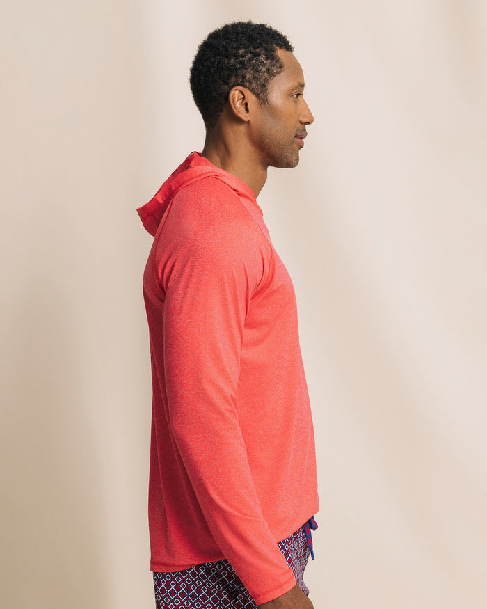 The side view of the Southern Tide Crossed Lines Coastal Breeze® Performance Hoodie by Southern Tide - Channel Marker Red