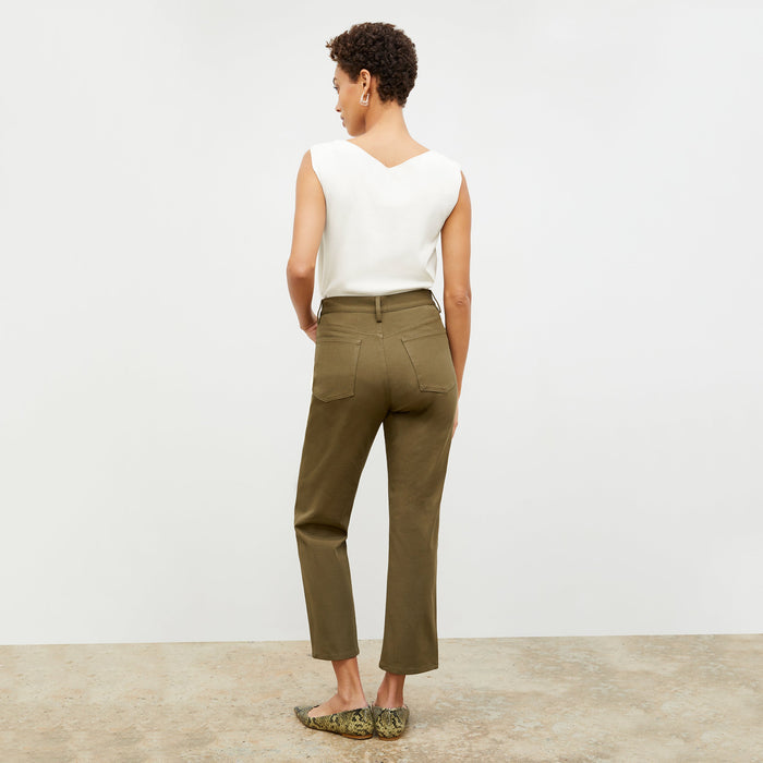 Back image of a woman standing wearing the Eileen Top in ivory
