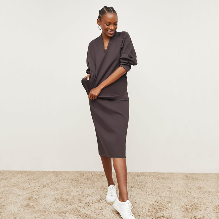 Front image of a woman standing wearing the Elsa Dress—Light Scuba in Haze