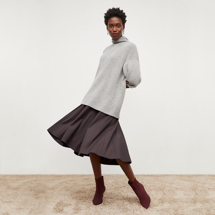 Front image of a woman standing wearing the Gabriella Dress in Haze