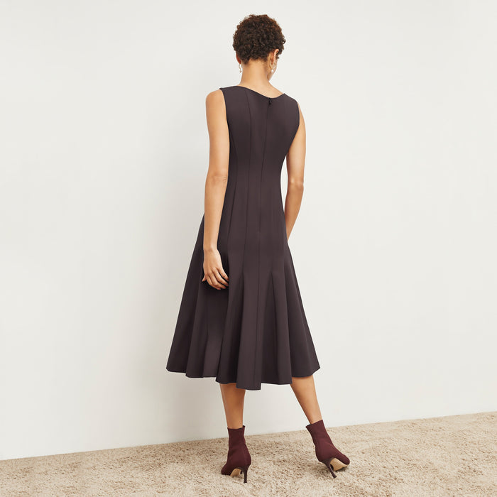 Back image of a woman standing wearing the Gabriella Dress in Haze
