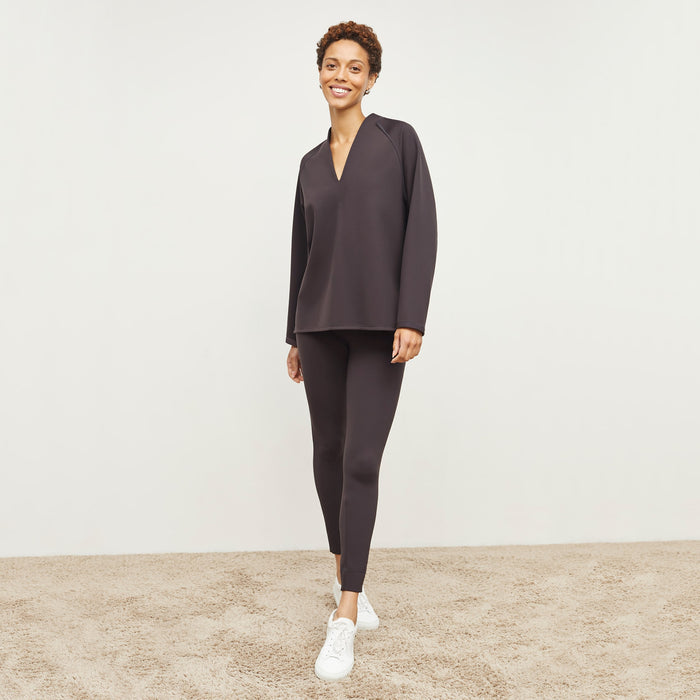 Front image of a woman standing wearing the Harrington Legging—Light Scuba in Haze | Lead