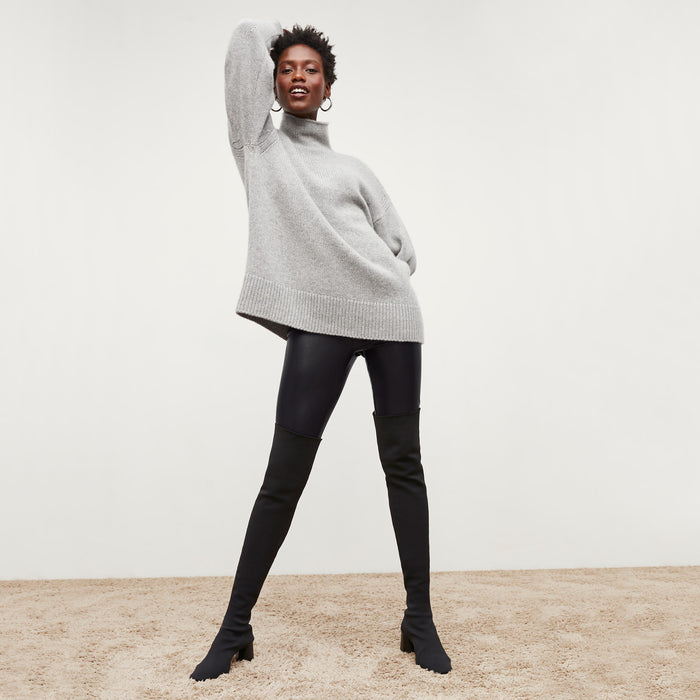 Front image of a woman standing wearing the Harrington Leather—Vegan Leather in Black