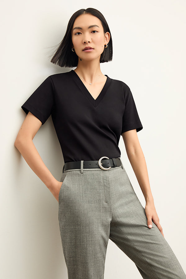 front image of a woman wearing the Lee T-Shirt in Black | Exclude | Grid