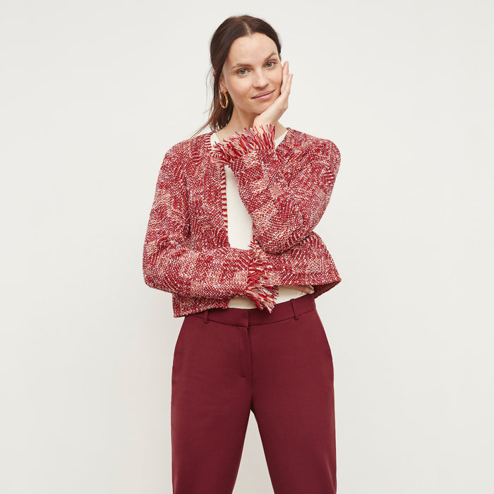 Front image of a woman standing wearing the Lilia Jacket—Interweave in Red Multi | Lead
