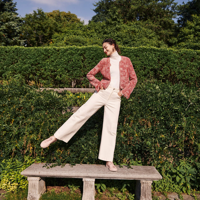 Front image of a woman standing wearing the Lilia Jacket—Interweave in Red Multi