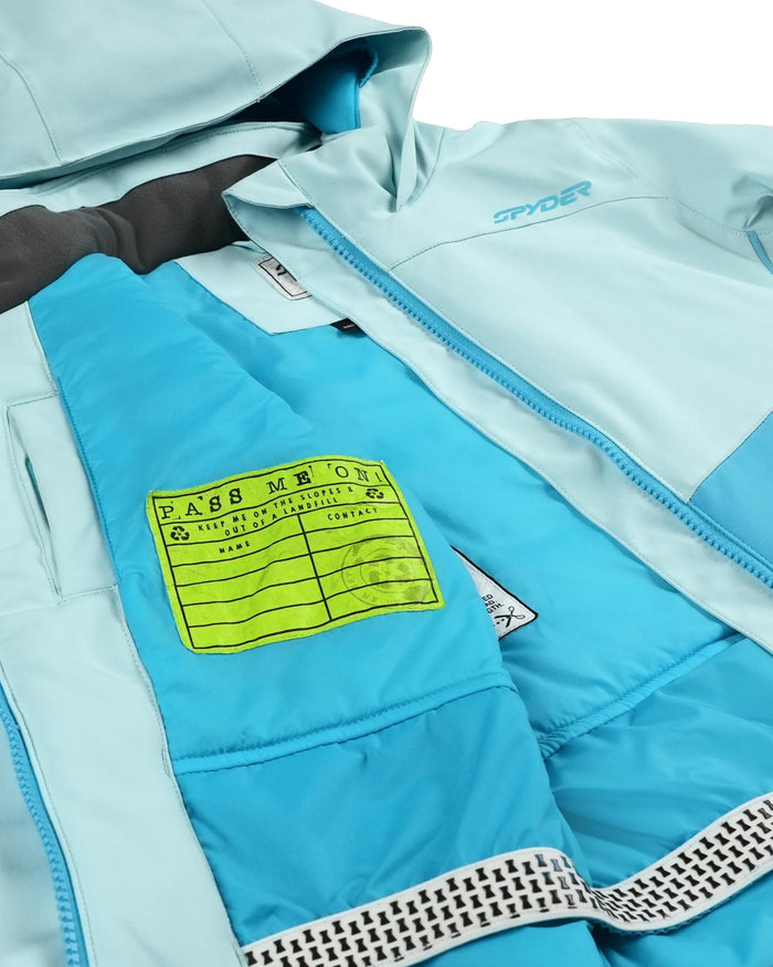 Light blue jacket with a yellow 'Pass Me On' label on a white background