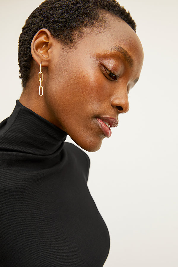 image of a woman wearing the martine earrings in gold | Exclude | Grid Hover