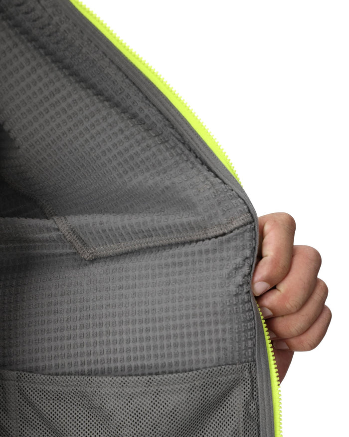 Gray bag with a yellow zipper held by a hand on a white background