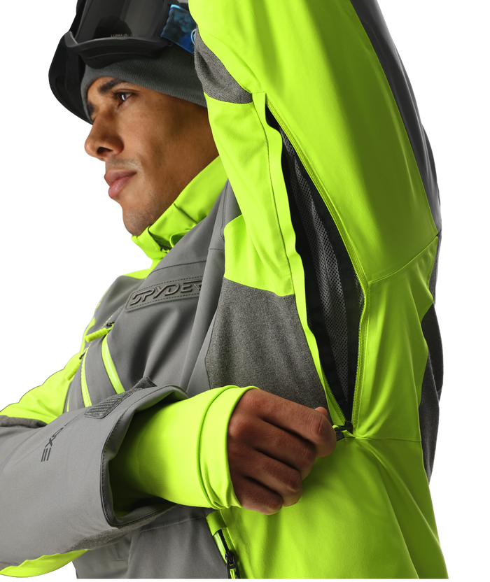 Person wearing a high-visibility jacket with a brand logo on a white background