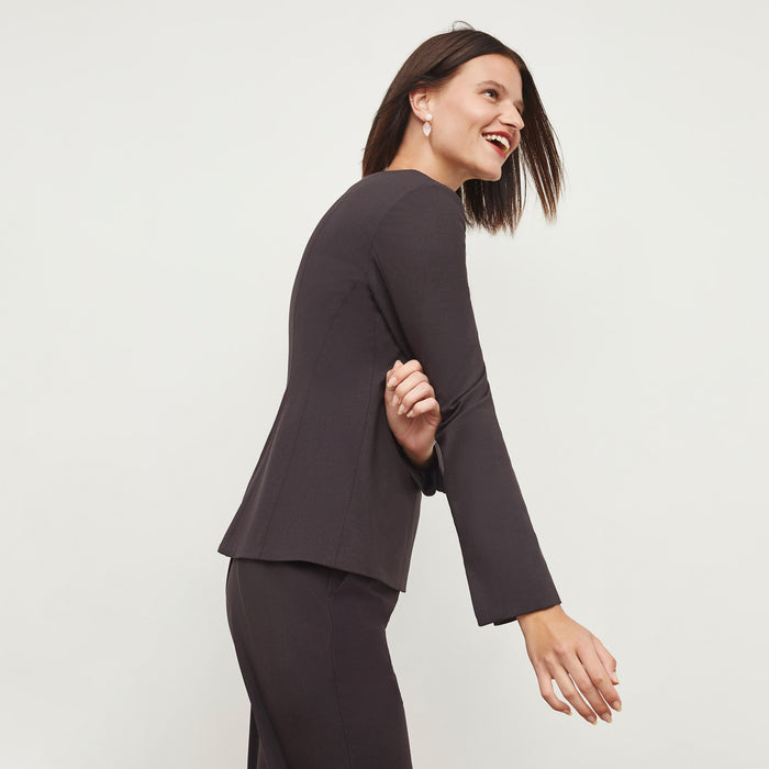 Side image of a woman standing wearing the Rivka Top in Haze