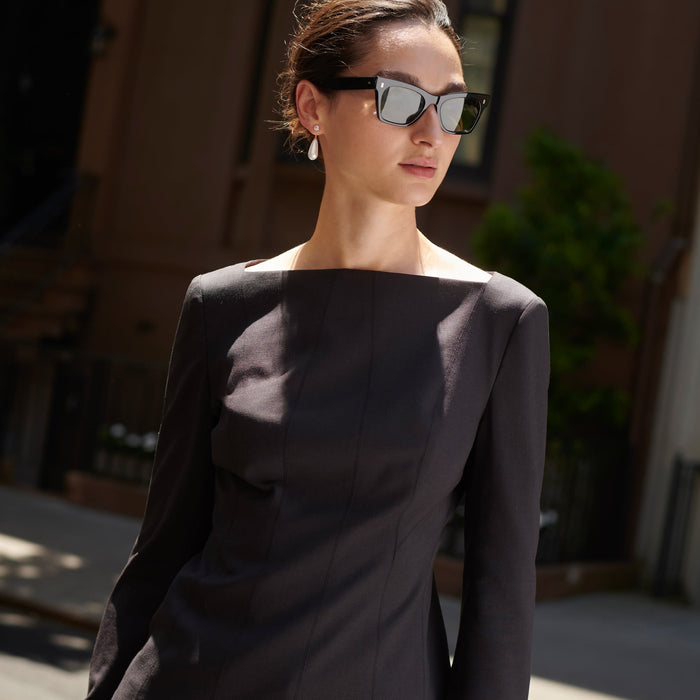 Front image of a woman standing wearing the Rivka Top in Haze