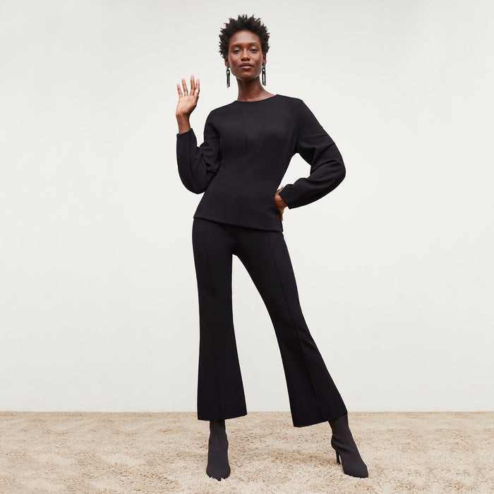 Front image of a woman standing wearing the Shiloh Pant in Black