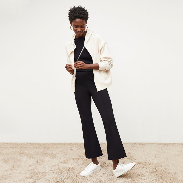 Front image of a woman standing wearing the Shiloh Pant in Black