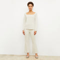 Front image of a woman standing wearing the Shiloh Pant in Pearl | Lead