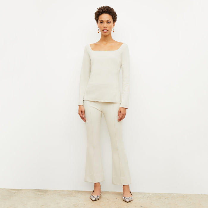 Front image of a woman standing wearing the Shiloh Pant in Pearl | Lead