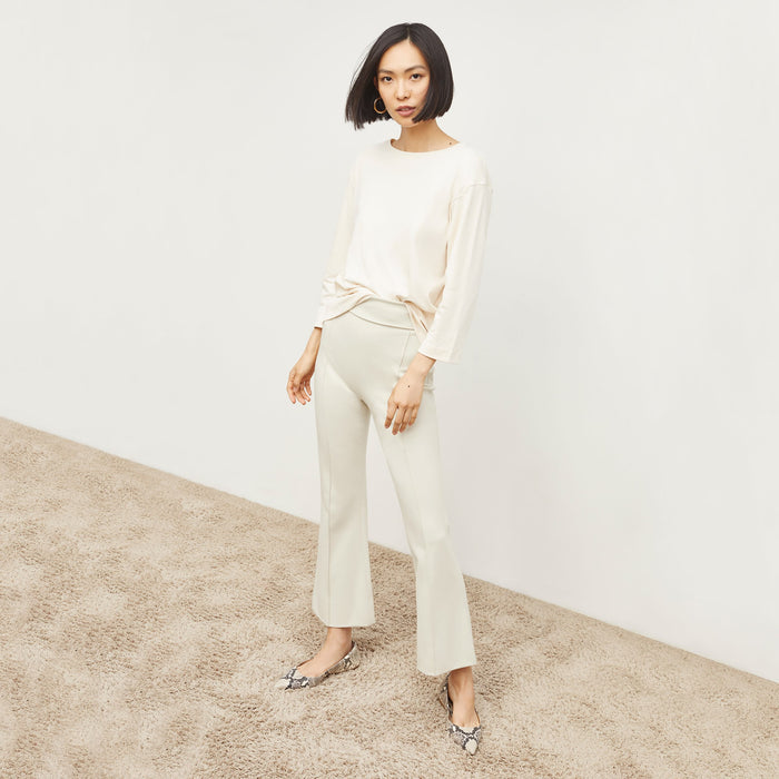 Front image of a woman standing wearing the Shiloh Pant in Pearl