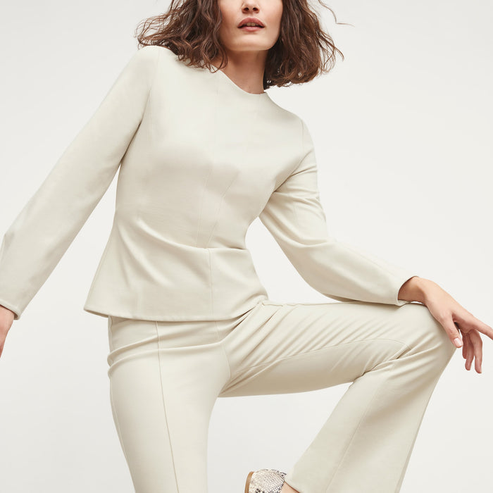 Detail image of a woman standing wearing the Shiloh Pant in Pearl