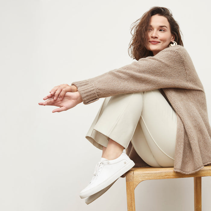 Side image of a woman standing wearing the Shiloh Pant in Pearl