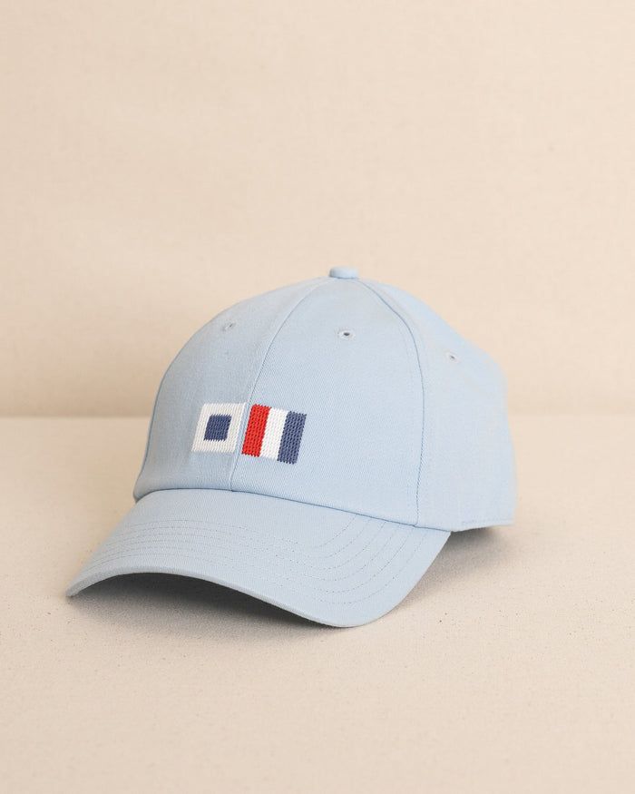 The front view of the Southern Tide ST Flag Leather Strap Hat by Southern Tide - Blue