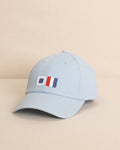 The front view of the Southern Tide ST Flag Leather Strap Hat by Southern Tide - Blue
