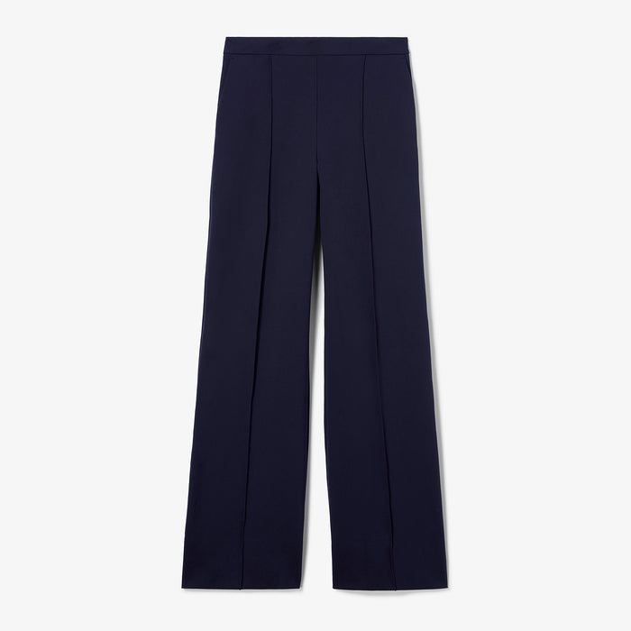 Navy blue pants on a light gray background | Still