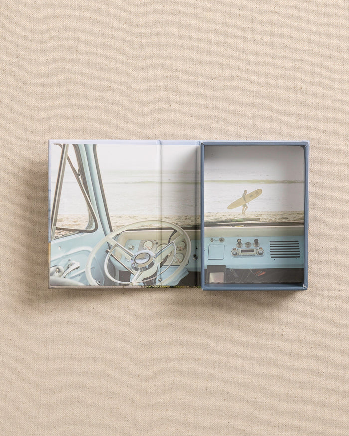 The open view of the Johnny Vacay Surf Rides Playing Cards at Southern Tide - White
