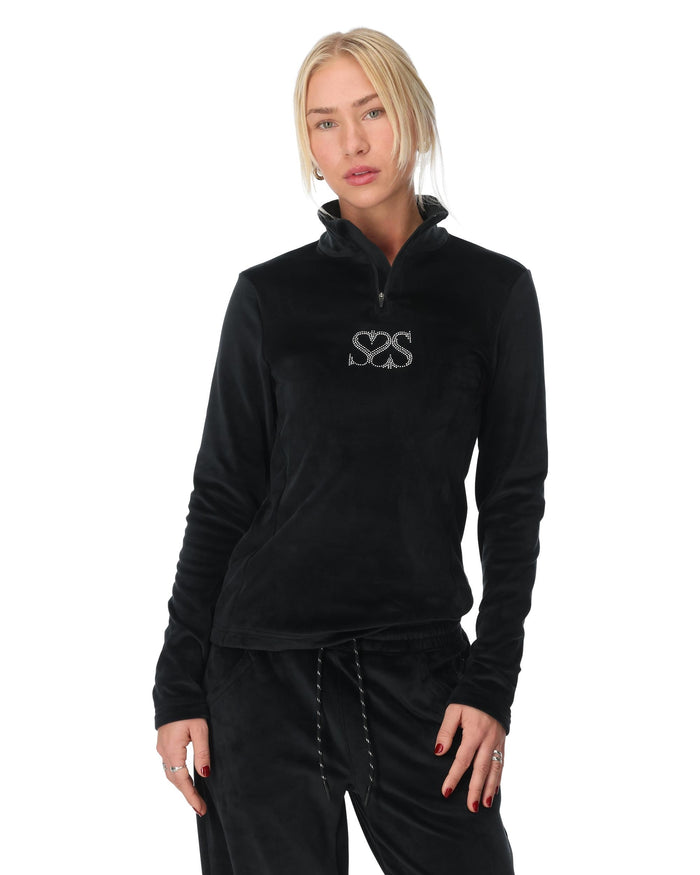 Woman wearing a black pullover with a logo on a white background